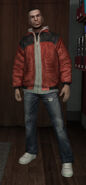 Red jacket with black shoulders and embroidery with a white hooded sweatshirt underneath.