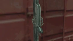 A padlock on the shipping container doors