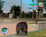 Tommy Vercetti fleeing the scene in a Landstalker.