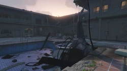 Police Maverick wreck after . The destroyed apartment is in the background