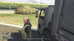 Grab a trash bag from the rear of the Trashmaster