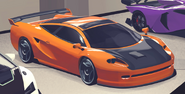 A custom orange Penetrator shown in an office garage, used in the promotional artwork, note the unused roof scoop and black stock rims.