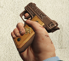 Etched Wood Grip Finish on the SNS Pistol.