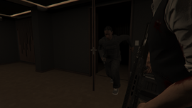 A gunman entering through a side door.