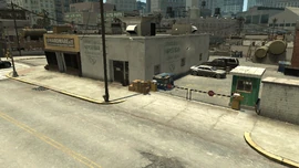 The hardware store, paper bag manufacturing, and car park.