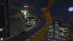 The racers follow the track past the 