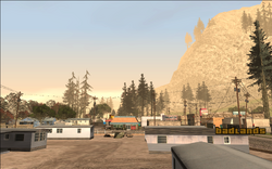 Carl looks over Mount Chiliad. Somewhere on the mountain is his target's hideout.