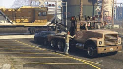 PullingFavorsAgain-GTAVe-PhilEntersTowTruck.png (2.82 MB) Phil gets in the tow truck as the train passes.