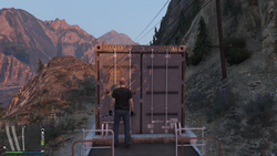 Container depth in a short wellcar in transit.