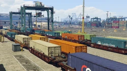 Shipping containers on railroad flat cars