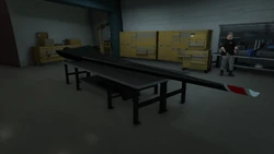 Avenger's wing and the TM-02 Khanjali's track in the workshop