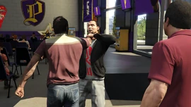 Trevor puts an arena employee into a chokehold.