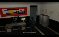 Tommy finds the manager in one of the back offices and tells him to come with him.