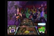 The male singer (right) as he appears in Guitar Hero II on stage with  (left)