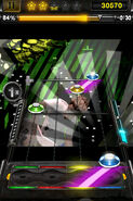 A green Tap Gem and Slide Gems from Y→B in Guitar Hero (iOS).