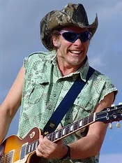 Ted Nugent performing live at an USO Naval Support Activity concert in Naples, Italy, in 2004.