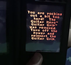The message that appears when you remove the Guitar Grip while playing the game.