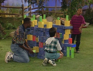 Ron, James, Bryan, Vanessa, and Marisol building a clubhouse out of blocks
