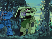 MS-07B Gouf (left) armed with H&L-GB03K/360mm giant bazooka during the Jaburo invasion in November 30, U.C. 0079