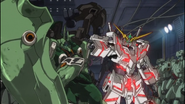 The semi-repaired Kshatriya besides the Unicorn Gundam