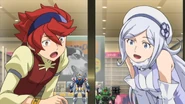 Reiji and Aila looking at the Gunpla they built themselves