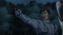 Sergei pointing his gun at Allelujah