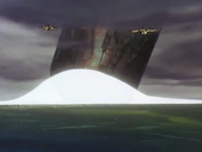 The colony impacts with the city as the Audhumla and Argama hover above the ocean.