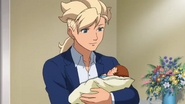 Asemu holding a baby Kio