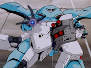 Hygogg uses a RGM-79D GM Cold Climate Type as a shield and prepares to fire