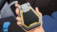 AGE Device (5).png (1.08 MB) Holding AGE Device (Kio Asuno)
