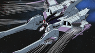 Freedom Gundam firing missiles from all the 60 cm "Erinaceus" Anti-Ship Missile Launchers