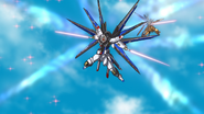 Strike Freedom activating its Voiture Lumiere after slightly separating its DRAGOONs on Earth in Destiny HD