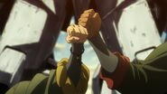 Mika fist-bumps with Orga.