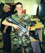 Colored photo of a soldier holding the AAI CAWS.