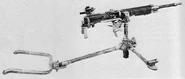Type 92 machine gun with optic and rear carrying pole on tripod.