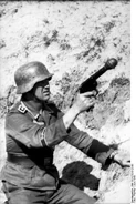 German officer with a Leuchtpistole loaded with a Wurfkörper 361 LP, 1943.