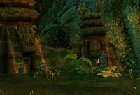 Two Hylek standing in front of hutlike dwellings