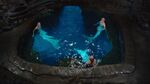 Nixie, Lyla, and Sirena sitting in the Moon Pool