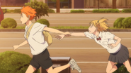 Hinata brings Yachi to her mother at the train station