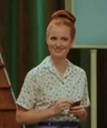 Corny's assistant in the Hairspray (2007)