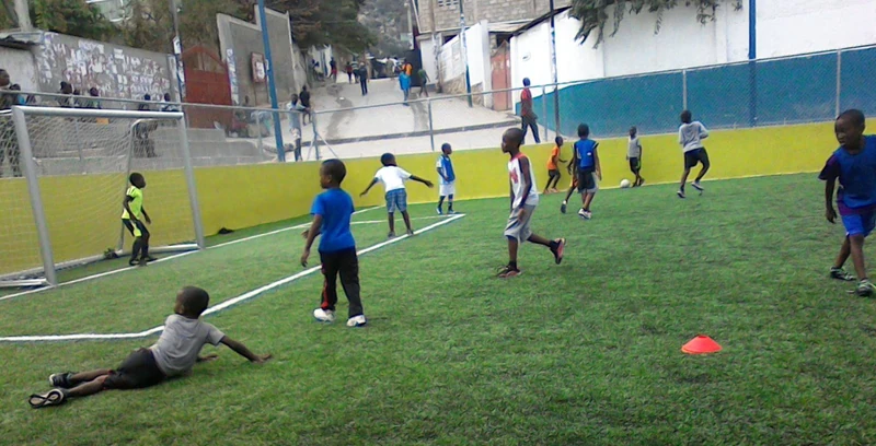 Youth football in Baillergeau, where the neighborhood’s next generation fills the hillside field with energy and confidence.