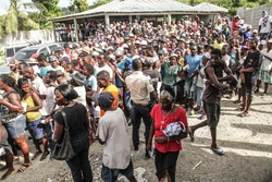 Local residents attend a community event; Arniquet,  