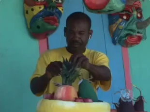 Local artisan preparing decorative pieces in Jacmel. Even the masks on the wall look like they’re waiting to see if the new terminal will finally bring more traffic.