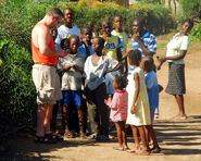 Haitian kids check out some Hot wheels cars