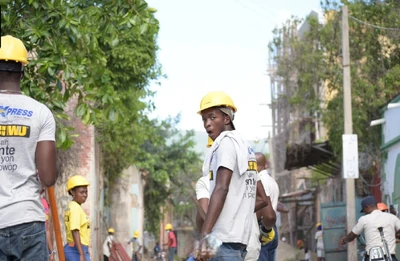 Local clean-up crews in the Bicentennaire district of , 