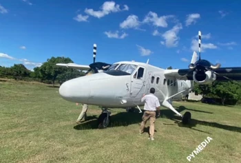 A Dornier 228 preparing for departure on Pignon's grass runway.