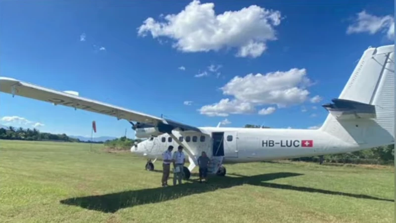 A Swiss-registered aircraft on the Pignon grass strip, one of the many mission and medical flights that keep the town connected.