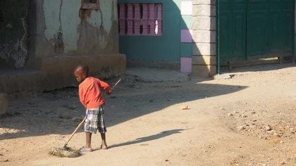 Young man grabs a broom; Mombin-Crochu, 