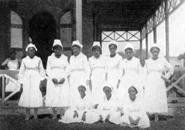 1921. Here stands a Haitian head nurse with other nurses in her charge.