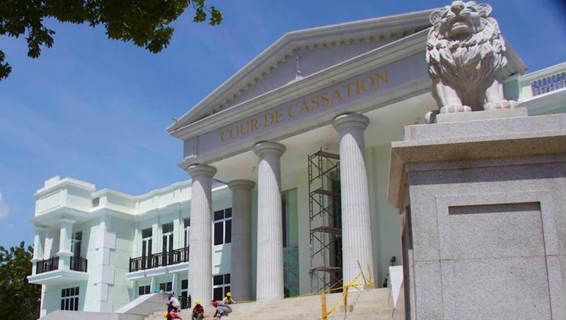 The newly rebuilt Court of Cassation on the northern edge of Champs de Mars, featuring its neoclassical façade and signature stone lions, photographed during final exterior work. The court anchors one of the park’s principal institutional frontages, forming a major civic landmark within the broader Champs de Mars complex.